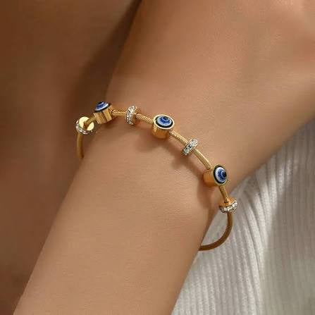 Evil eye kada: Anti-tarnish gold plated.