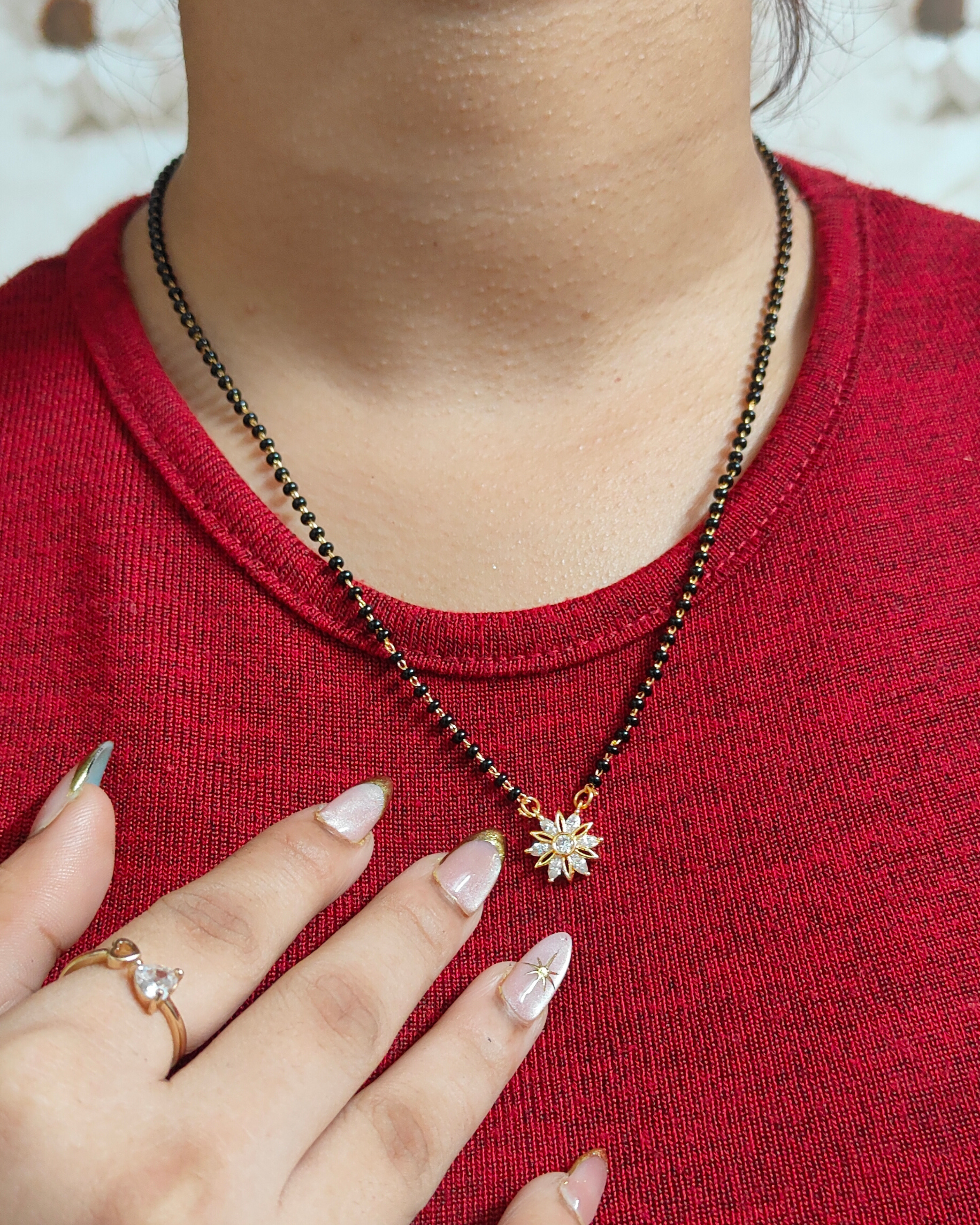 Tejasvi mangalsutra with gold chain, black beads and circular diamond pendant