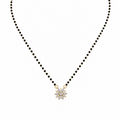 Tejasvi mangalsutra with gold chain, black beads and circular diamond pendant